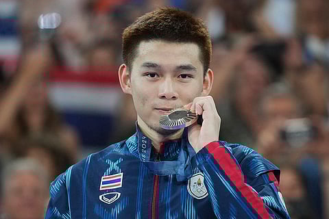 Badminton Men's singles: Thailand's Kunlavut Vitidsarn celebrates after winning the silver medal